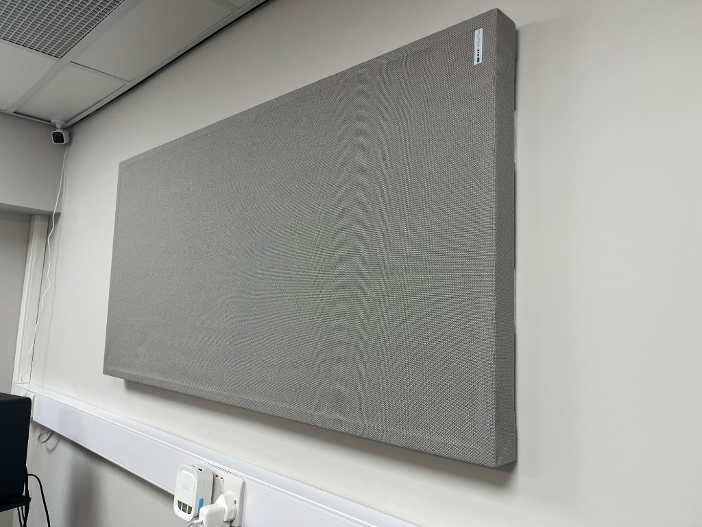 Control room at Warrington Music Studio with acoustic wall treatment and recording setup