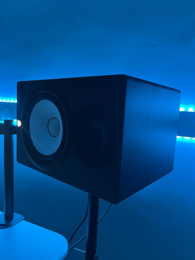 Yamaha HS nearfield studio monitor on a stand in blue-lit Warrington Music Studio, Cheshire.